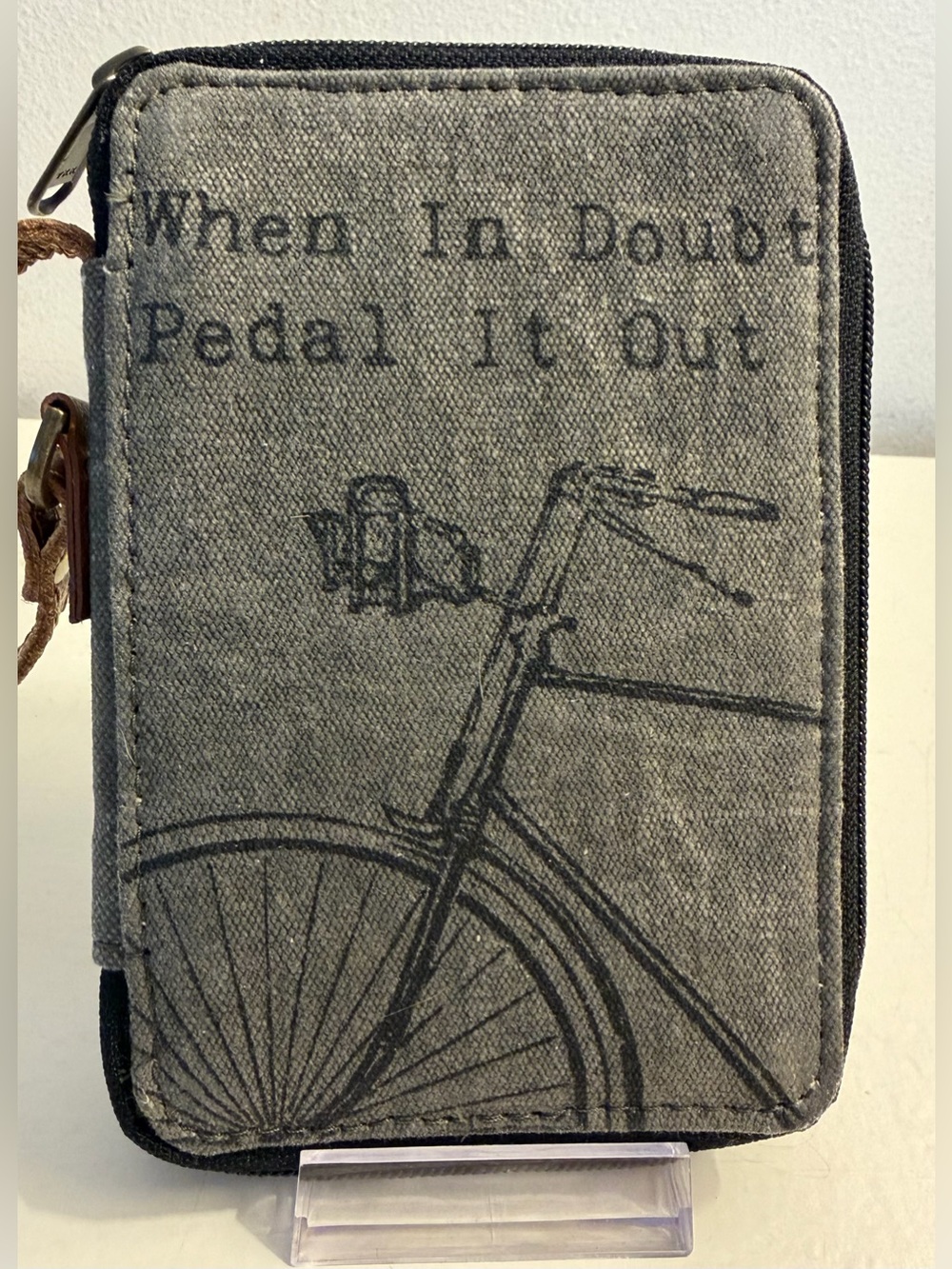 Mona B zip around cotton wristlet with leather trim & bicycle graphic & quote.